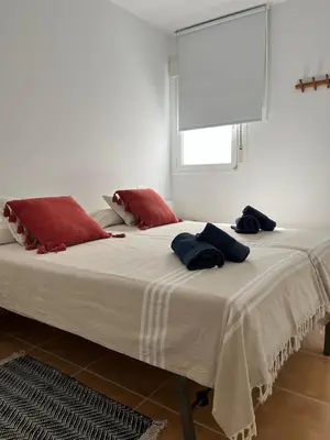 Cama o camas de una habitación en Ático en primera línea de playa
