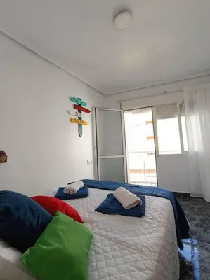 Cama o camas de una habitación en casita en playa de la colonia