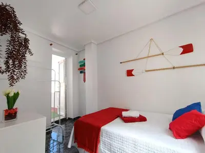 Cama o camas de una habitación en casita en playa de la colonia