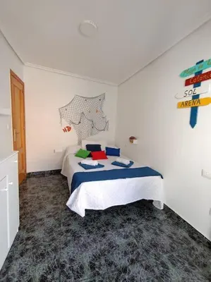 Cama o camas de una habitación en casita en playa de la colonia