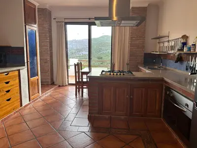 Una cocina o zona de cocina en Romántico estudio rodeado de naturaleza con jacuzzi gigante