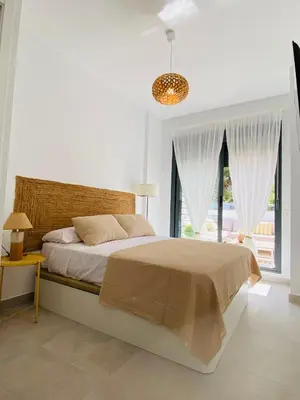 Cama o camas de una habitación en Aire del mediterráneo- Garrucha