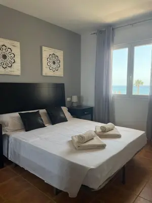 Cama o camas de una habitación en Casa Manila Primera línea de playa Mojácar
