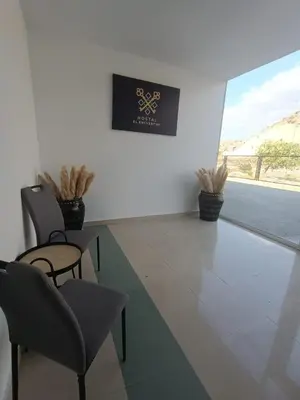 Una televisión o centro de entretenimiento en Hostal El Encuentro