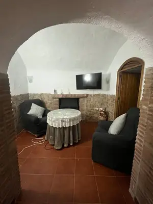 Una televisión o centro de entretenimiento en Casa Cueva la estación