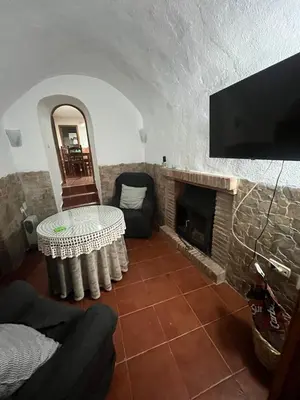 Una televisión o centro de entretenimiento en Casa Cueva la estación