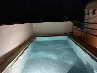 Piscina en o cerca de Atico duplex con piscina privada, solárium y barbacoa