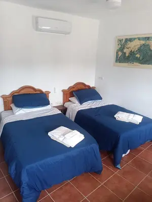 Cama o camas de una habitación en Casa De Aventuras ideal for large groups