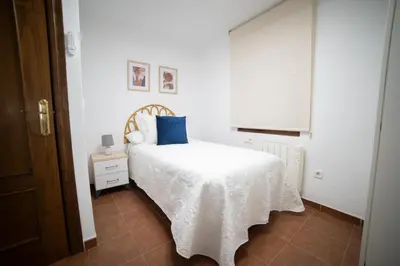 Cama o camas de una habitación en Guadix Catedral