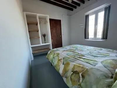 Cama o camas de una habitación en Cortijo MAMANGUEÑA PISCINA Y CUEVA