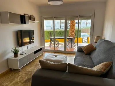 Una televisión o centro de entretenimiento en Magnífico apartamento en Vera