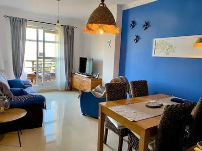 Una televisión o centro de entretenimiento en Casa Terrazas Del Golf - Mojacar Playa