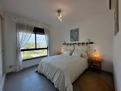 Cama o camas de una habitación en ViveVera - Chalet Palmera Golf Valle del Este