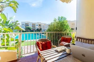 Un balcón o terraza de TrendyHomes Retamar III - Playa, piscina y golf