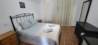 Cama o camas de una habitación en Alojamiento La tinaja