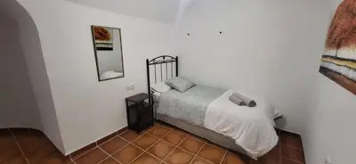 Cama o camas de una habitación en Alojamiento La tinaja