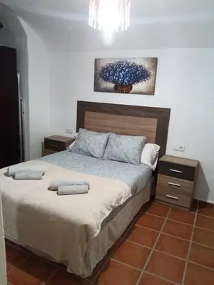 Cama o camas de una habitación en Alojamiento La tinaja
