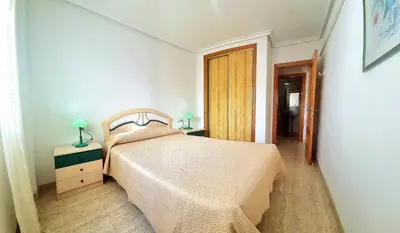 Cama o camas de una habitación en Apartamento 2 dormitorios soleado Veramar 5, 1ª planta
