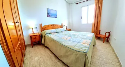 Cama o camas de una habitación en Ático VERAMAR 1 frente a piscina dos dormitorios