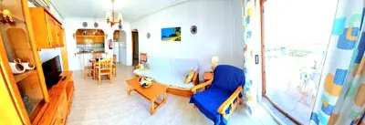 Zona de estar de Ático VERAMAR 1 frente a piscina dos dormitorios