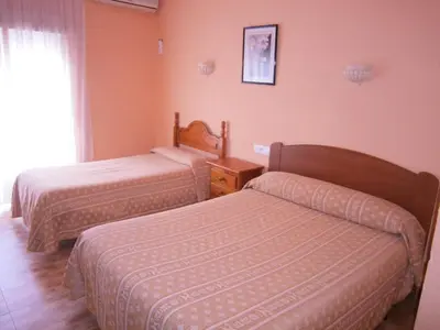 Cama o camas de una habitación en Hostal rural El Caminero