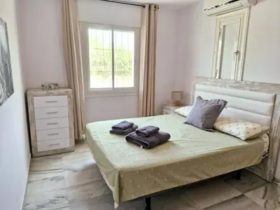 Cama o camas de una habitación en Bajo Golf Center Pueblo