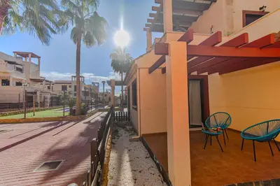 Un balcón o terraza de Los Collados con Jardín y Piscina By Aloha Palma