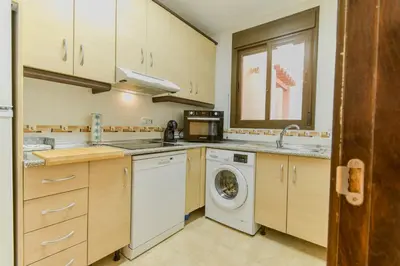 Una cocina o zona de cocina en Los Collados con Jardín y Piscina By Aloha Palma