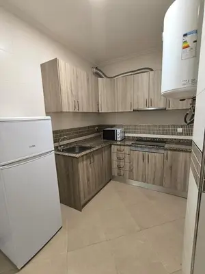 Una cocina o zona de cocina en APARTAMENTO TURISTICO 1ºA CARLOS III - Cerca de la playa
