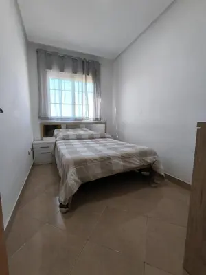 Cama o camas de una habitación en APARTAMENTO TURISTICO 1ºA CARLOS III - Cerca de la playa
