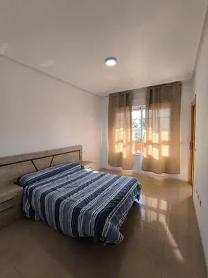 Cama o camas de una habitación en APARTAMENTO TURISTICO 1ºE CARLOS III - Cerca de la playa