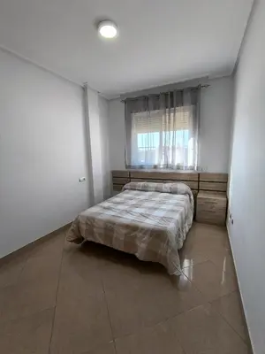 Cama o camas de una habitación en APARTAMENTO TURISTICO 2ºA CARLOS III - Cerca de la playa