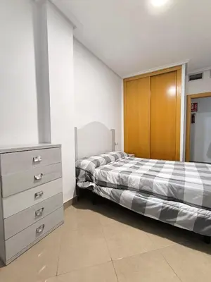 Cama o camas de una habitación en APARTAMENTO TURISTICO 2ºE CARLOS III - Cerca de la playa