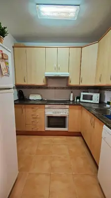 Una cocina o zona de cocina en Apartamento ideal a un paso de la playa
