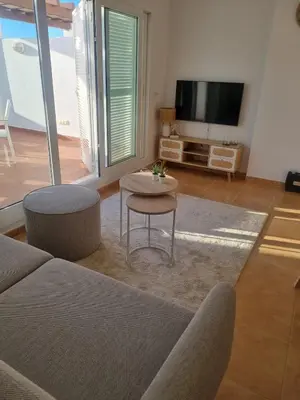 Una televisión o centro de entretenimiento en Beautiful luxury apartment with sea view Mojacar Playa