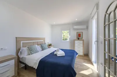 Cama o camas de una habitación en AlmeriaSuite Villa Las Golondrinas
