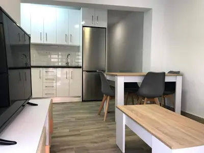 Una cocina o zona de cocina en tuAnfitrion Almería Beach II