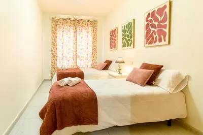 Cama o camas de una habitación en PLAYA LEVANTE céntrico y con Parking By Aloha Palma