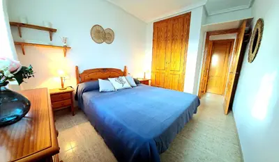 Cama o camas de una habitación en Ático VERAMAR 3 1 dormitorio con vistas al mar 2º línea de playa