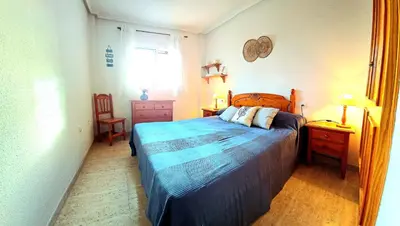 Cama o camas de una habitación en Ático VERAMAR 3 1 dormitorio con vistas al mar 2º línea de playa