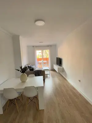 Una televisión o centro de entretenimiento en Apartamento Villas de Almerimar