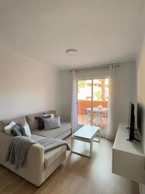 Una televisión o centro de entretenimiento en Apartamento Villas de Almerimar