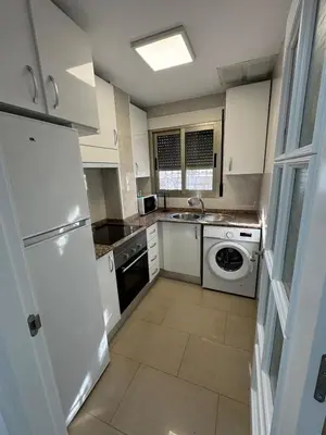 Una cocina o zona de cocina en Apartamento Moderno junto al Paseo y playa en Garrucha 2A