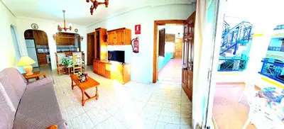 Una televisión o centro de entretenimiento en Apartamento dos dormitorios VERAMAR 5 1ª planta