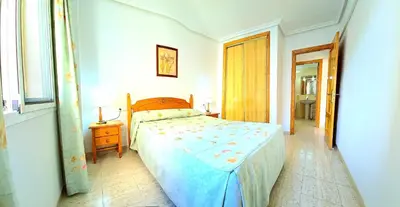 Cama o camas de una habitación en Apartamento dos dormitorios VERAMAR 5 1ª planta