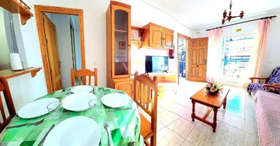 Una televisión o centro de entretenimiento en Apartamento dos dormitorios VERAMAR 5 1ª planta