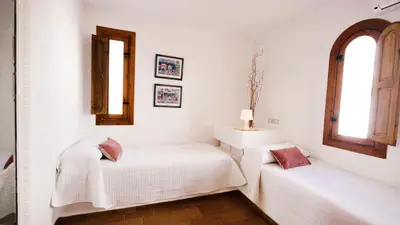 Cama o camas de una habitación en Casa Nieto con vistas al mar