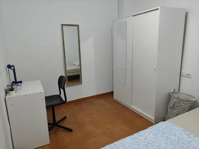 Cama o camas de una habitación en Al-Mariyya Centro Ciudad