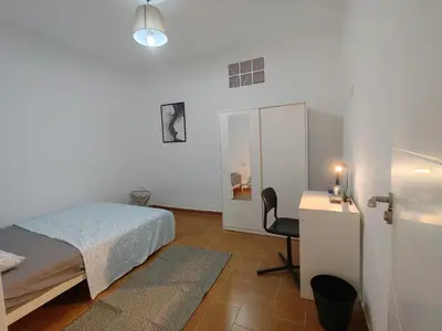 Cama o camas de una habitación en Al-Mariyya Centro Ciudad