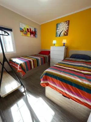 Cama o camas de una habitación en Casita Está Aquí